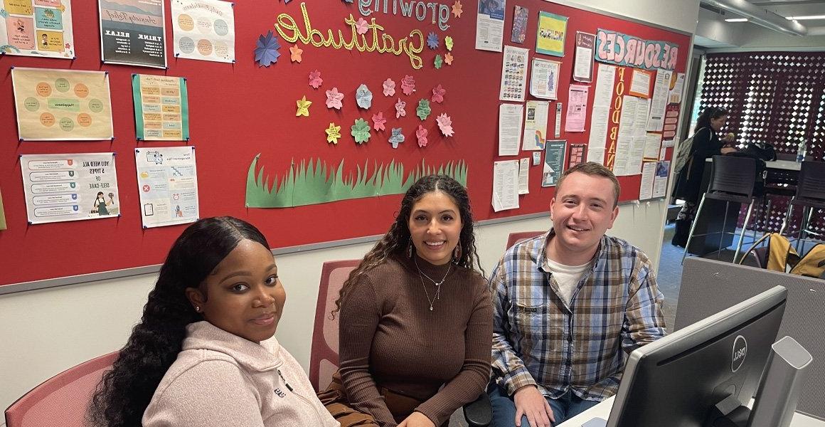 Three student navigators at Learning 4 Life Office